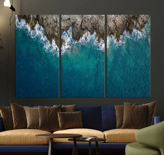 The wall is adorned with the Stone and Aerial Beach Wall Art Canvas Print, crafted by professional artisans, contributing an air of sophistication to the space.