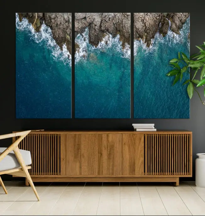 The wall is adorned with the Stone and Aerial Beach Wall Art Canvas Print, crafted by professional artisans, contributing an air of sophistication to the space.