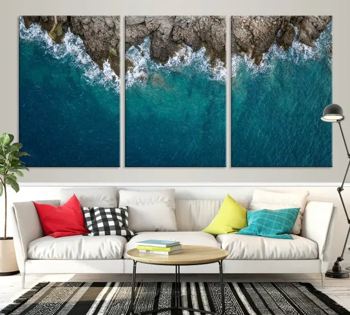 The wall is adorned with the Stone and Aerial Beach Wall Art Canvas Print, crafted by professional artisans, contributing an air of sophistication to the space.