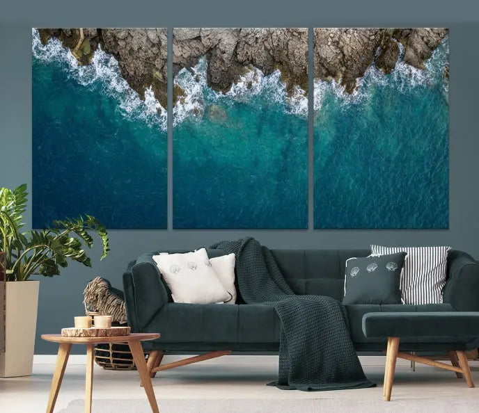 The wall is adorned with the Stone and Aerial Beach Wall Art Canvas Print, crafted by professional artisans, contributing an air of sophistication to the space.