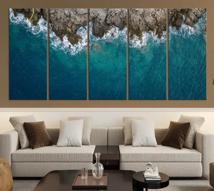 The wall is adorned with the Stone and Aerial Beach Wall Art Canvas Print, crafted by professional artisans, contributing an air of sophistication to the space.