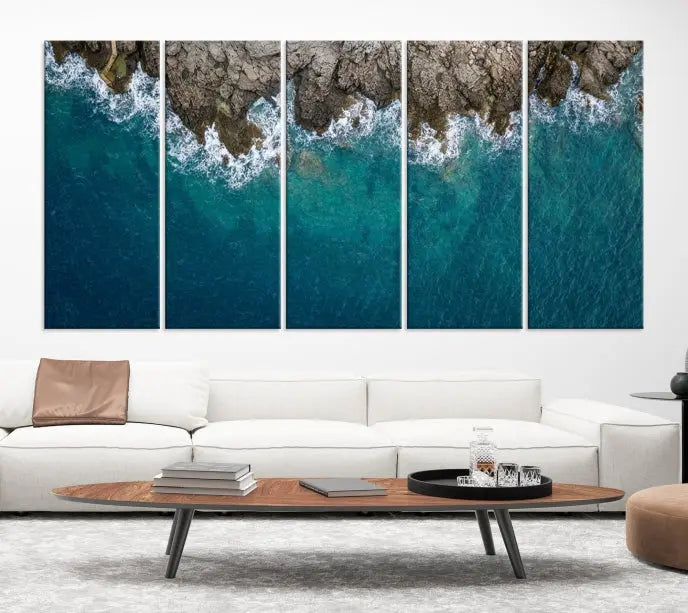 The wall is adorned with the Stone and Aerial Beach Wall Art Canvas Print, crafted by professional artisans, contributing an air of sophistication to the space.