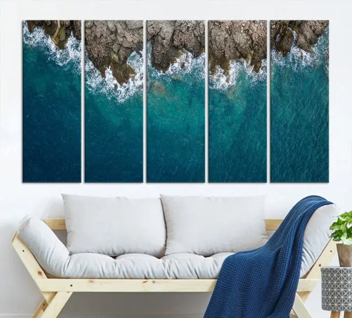 The wall is adorned with the Stone and Aerial Beach Wall Art Canvas Print, crafted by professional artisans, contributing an air of sophistication to the space.