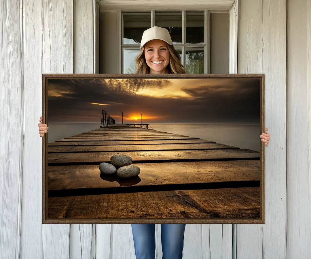 A Stones on Wooden Pier at Sunset canvas print featuring serene coastal art.