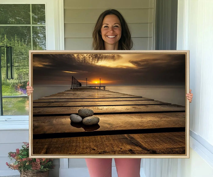 A Stones on Wooden Pier at Sunset canvas print featuring serene coastal art.