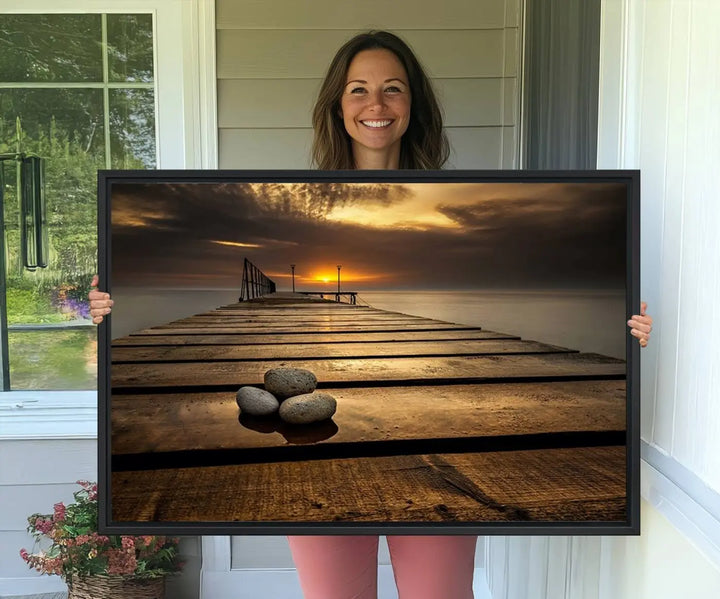 A Stones on Wooden Pier at Sunset canvas print featuring serene coastal art.