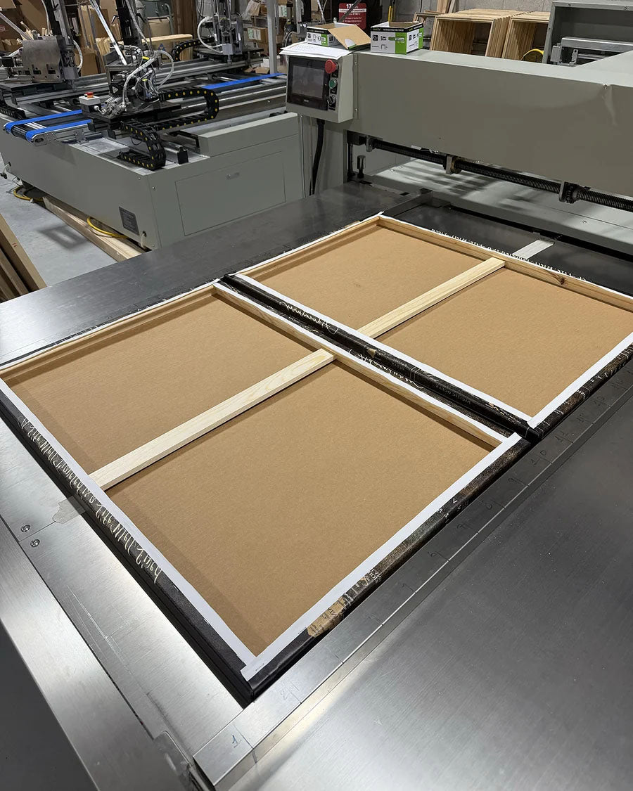 Canvas stretched over solid wood bars.