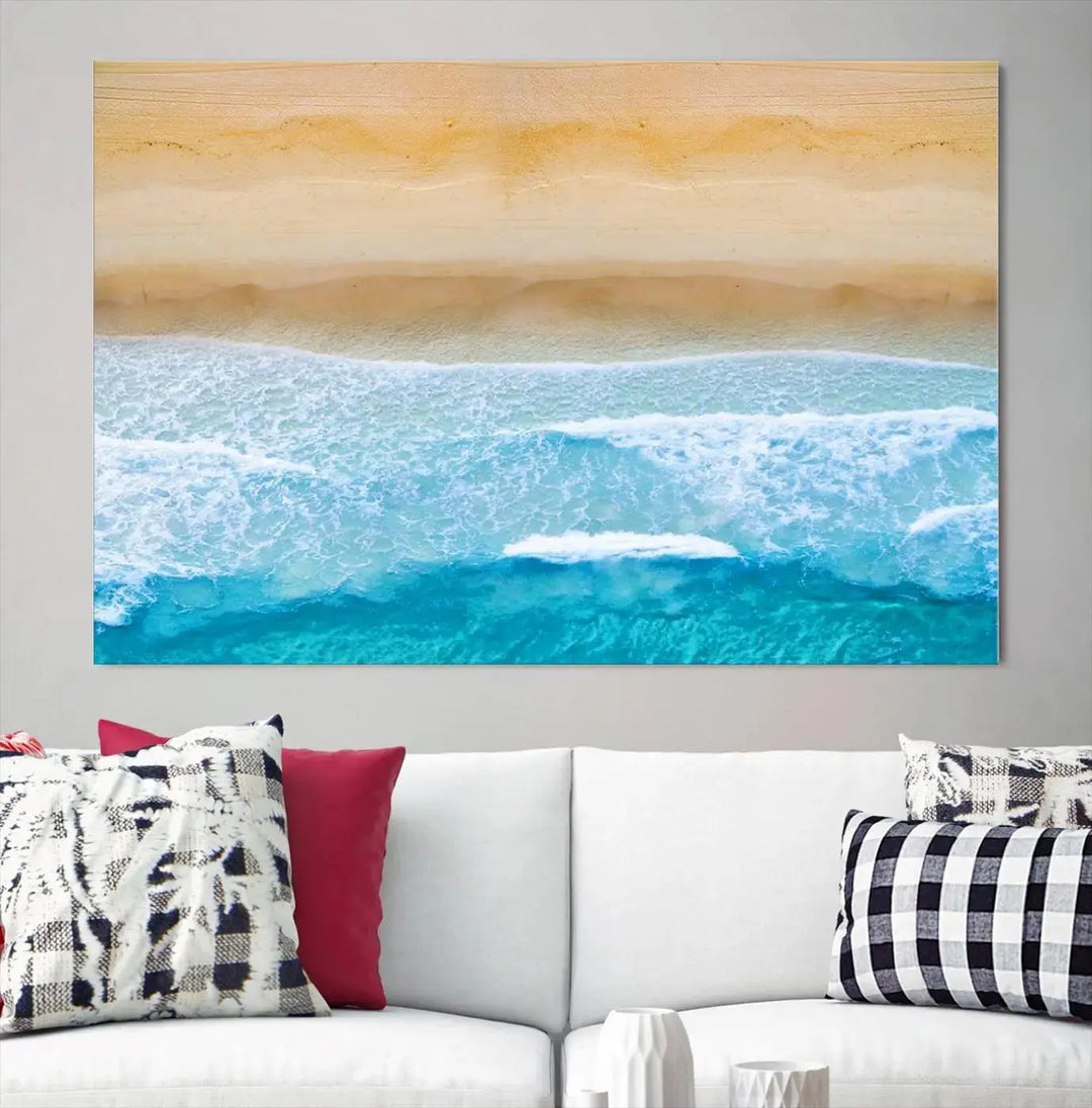 The Stunning Aerial Beach Canvas Print Wall Art, depicting turquoise waves and golden sand, is printed on museum-quality canvas.