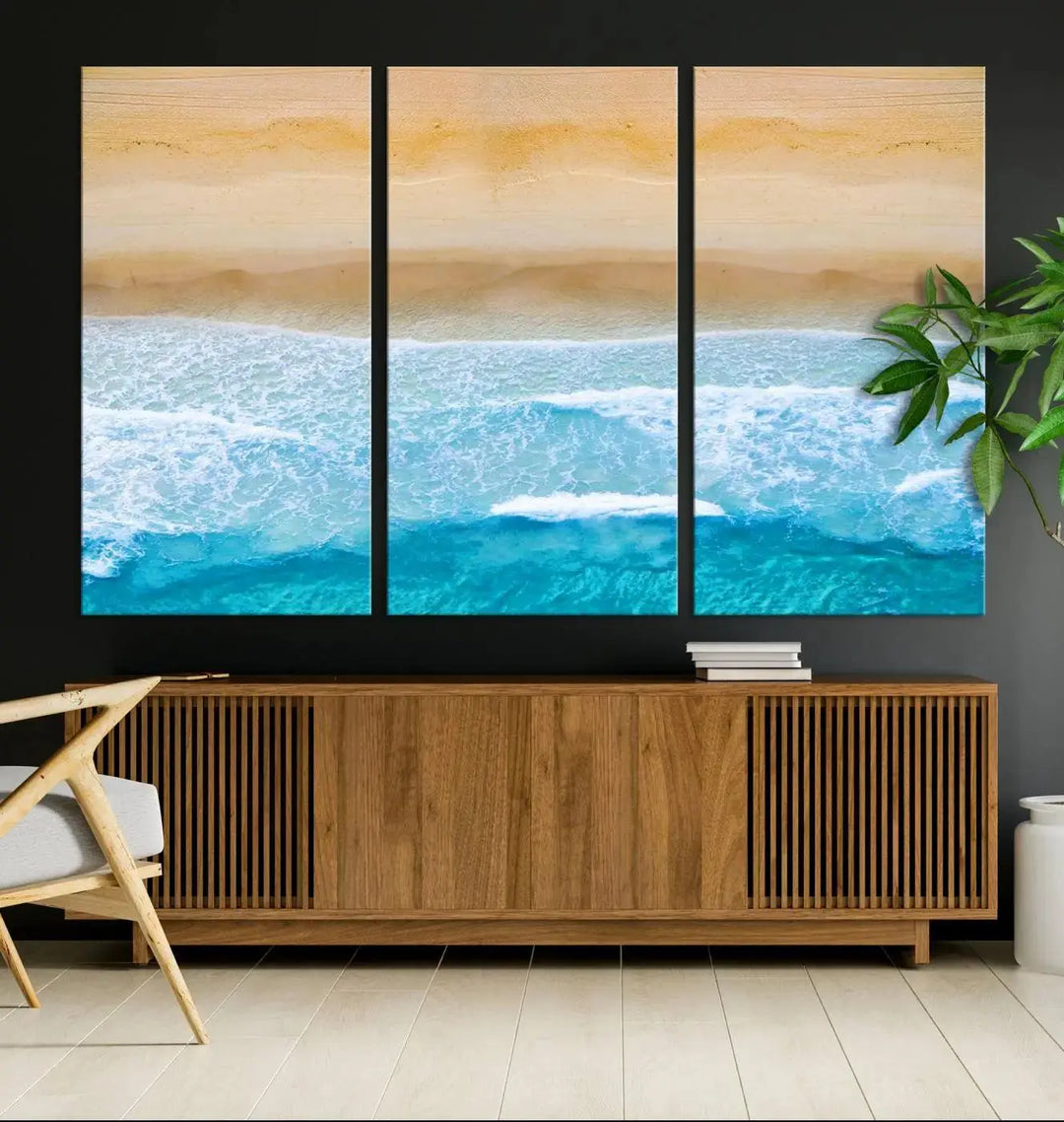 The Stunning Aerial Beach Canvas Print Wall Art, depicting turquoise waves and golden sand, is printed on museum-quality canvas.