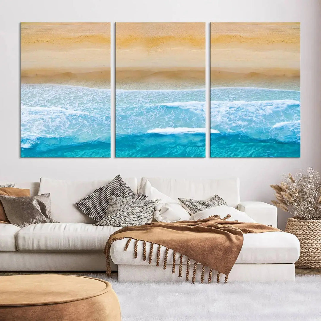 The Stunning Aerial Beach Canvas Print Wall Art, depicting turquoise waves and golden sand, is printed on museum-quality canvas.