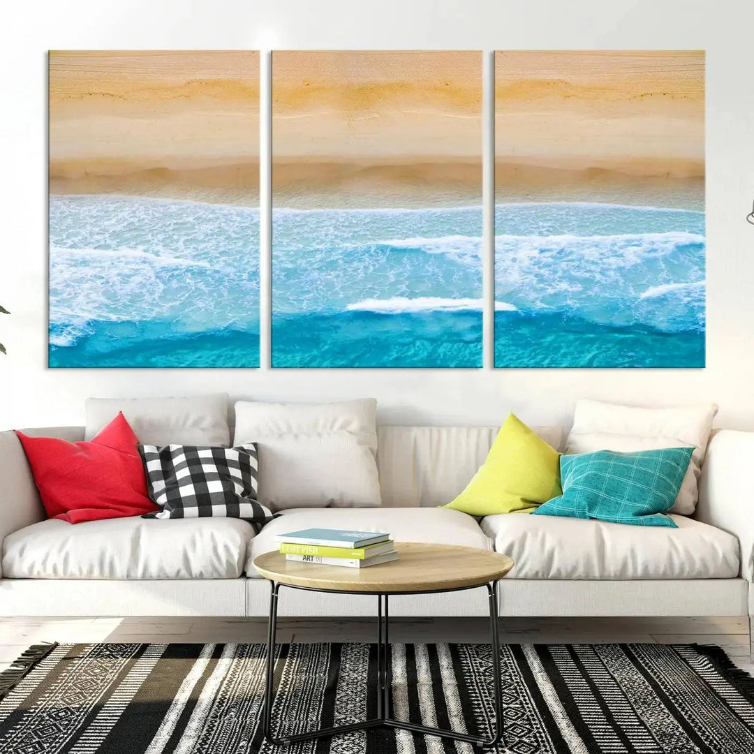 The Stunning Aerial Beach Canvas Print Wall Art, depicting turquoise waves and golden sand, is printed on museum-quality canvas.