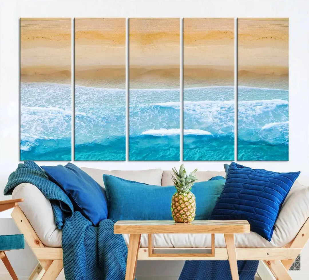 The Stunning Aerial Beach Canvas Print Wall Art, depicting turquoise waves and golden sand, is printed on museum-quality canvas.