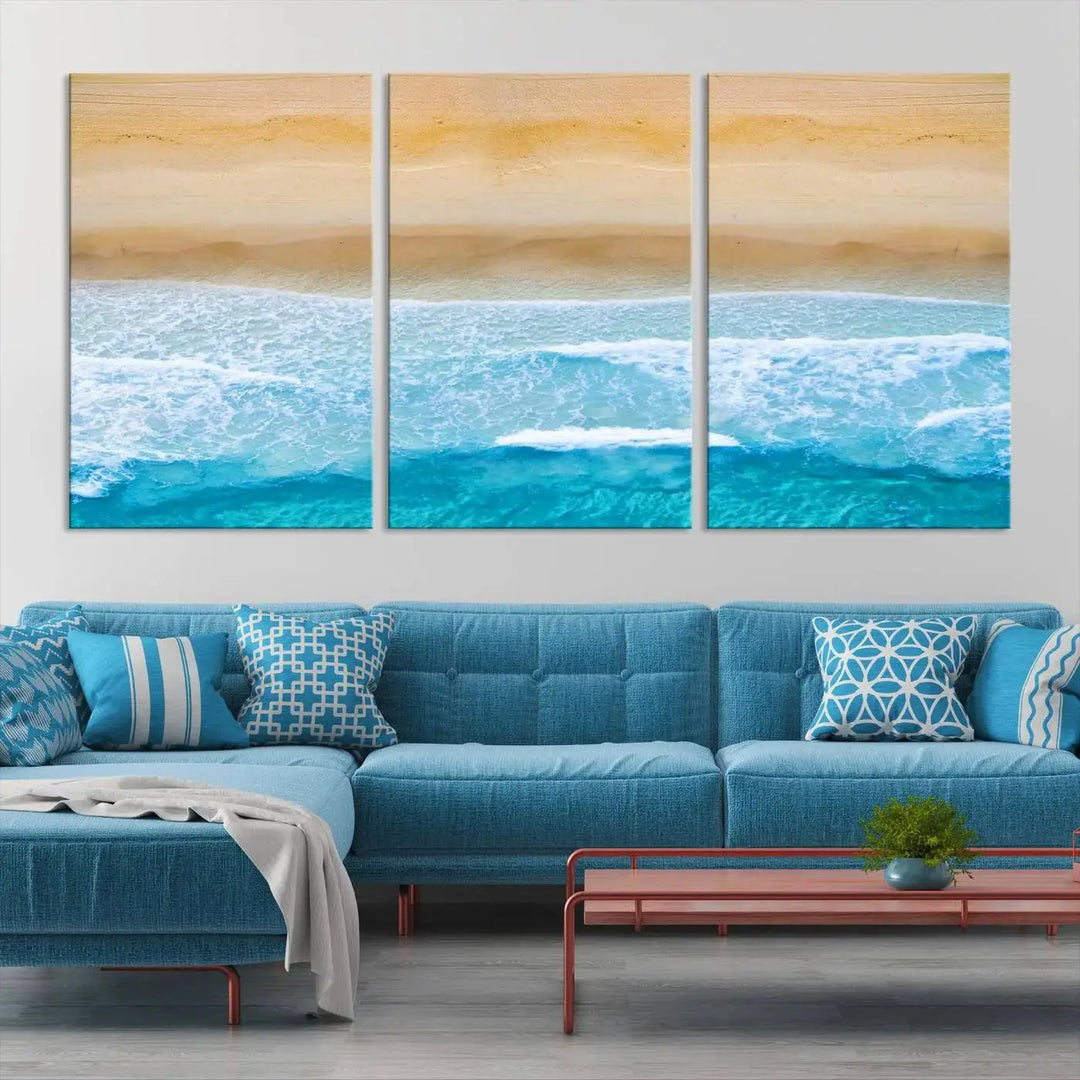 The Stunning Aerial Beach Canvas Print Wall Art, depicting turquoise waves and golden sand, is printed on museum-quality canvas.