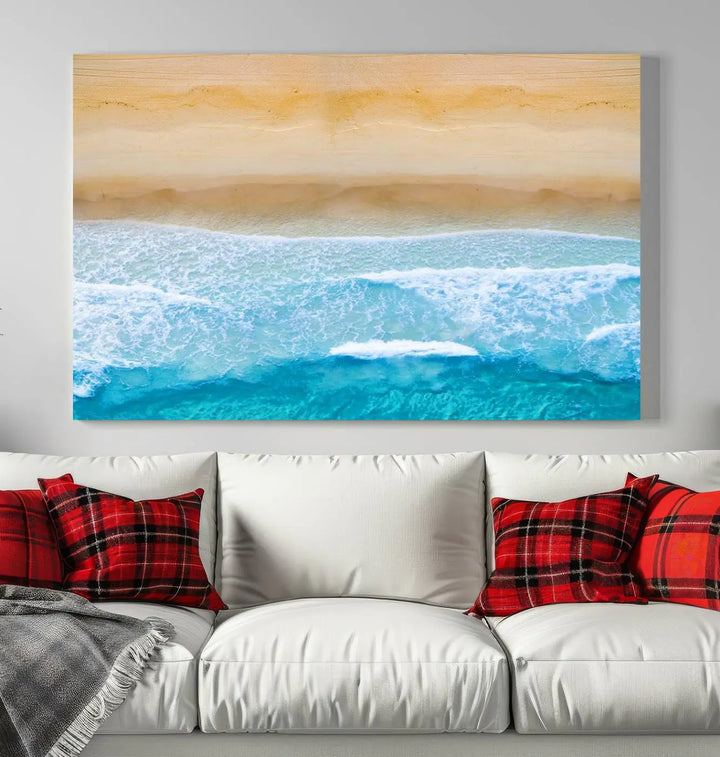 The Stunning Aerial Beach Canvas Print Wall Art, depicting turquoise waves and golden sand, is printed on museum-quality canvas.