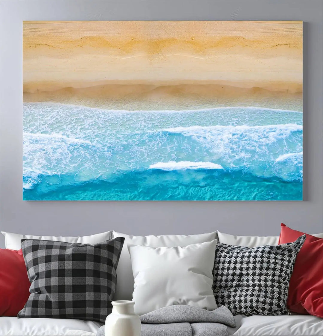 The Stunning Aerial Beach Canvas Print Wall Art, depicting turquoise waves and golden sand, is printed on museum-quality canvas.