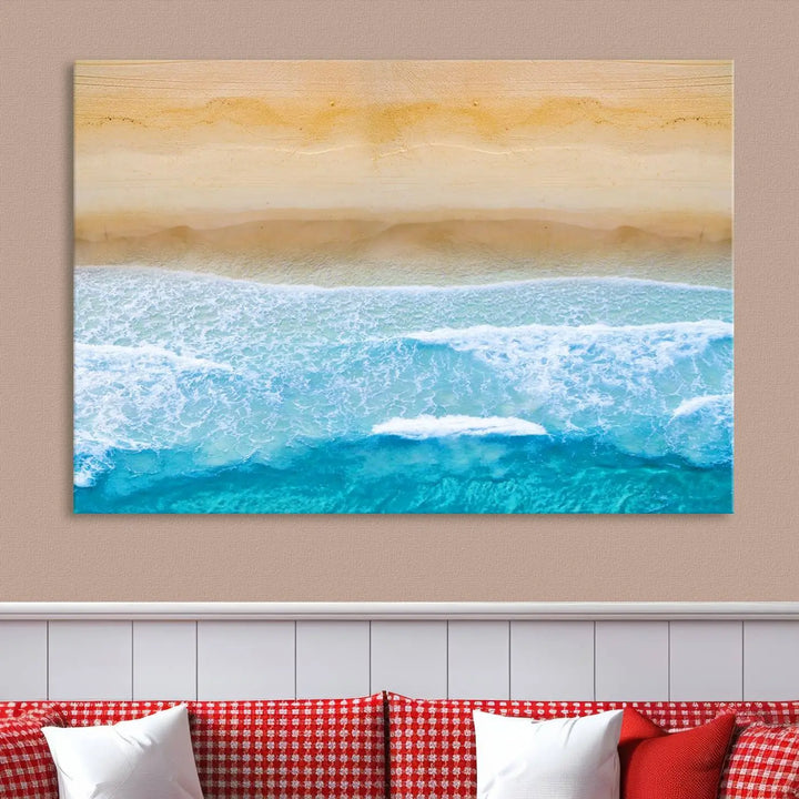 The Stunning Aerial Beach Canvas Print Wall Art, depicting turquoise waves and golden sand, is printed on museum-quality canvas.