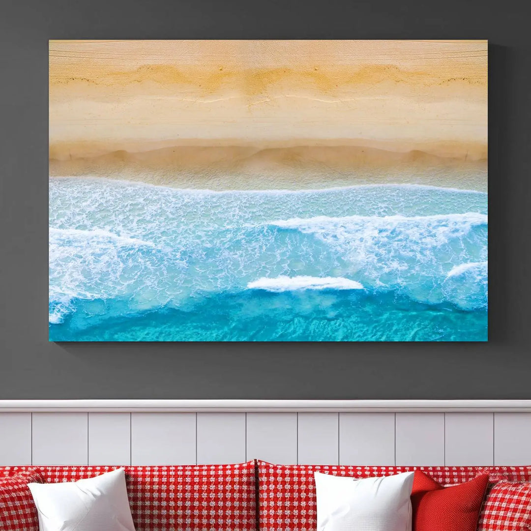 The Stunning Aerial Beach Canvas Print Wall Art, depicting turquoise waves and golden sand, is printed on museum-quality canvas.