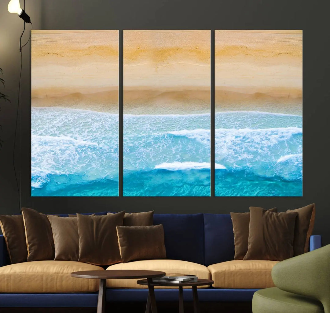 The Stunning Aerial Beach Canvas Print Wall Art, depicting turquoise waves and golden sand, is printed on museum-quality canvas.