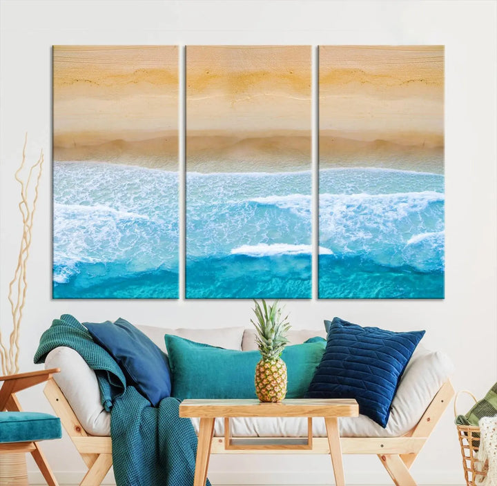 The Stunning Aerial Beach Canvas Print Wall Art, depicting turquoise waves and golden sand, is printed on museum-quality canvas.