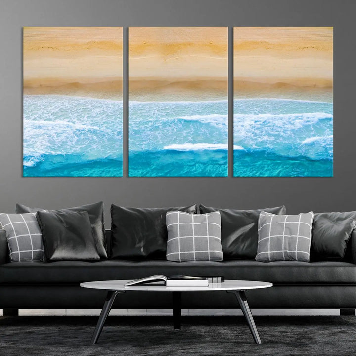 The Stunning Aerial Beach Canvas Print Wall Art, depicting turquoise waves and golden sand, is printed on museum-quality canvas.