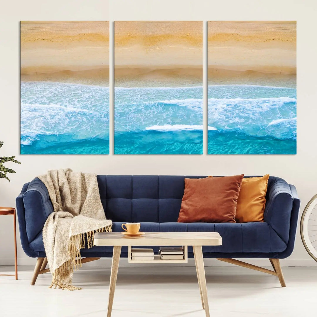 The Stunning Aerial Beach Canvas Print Wall Art, depicting turquoise waves and golden sand, is printed on museum-quality canvas.