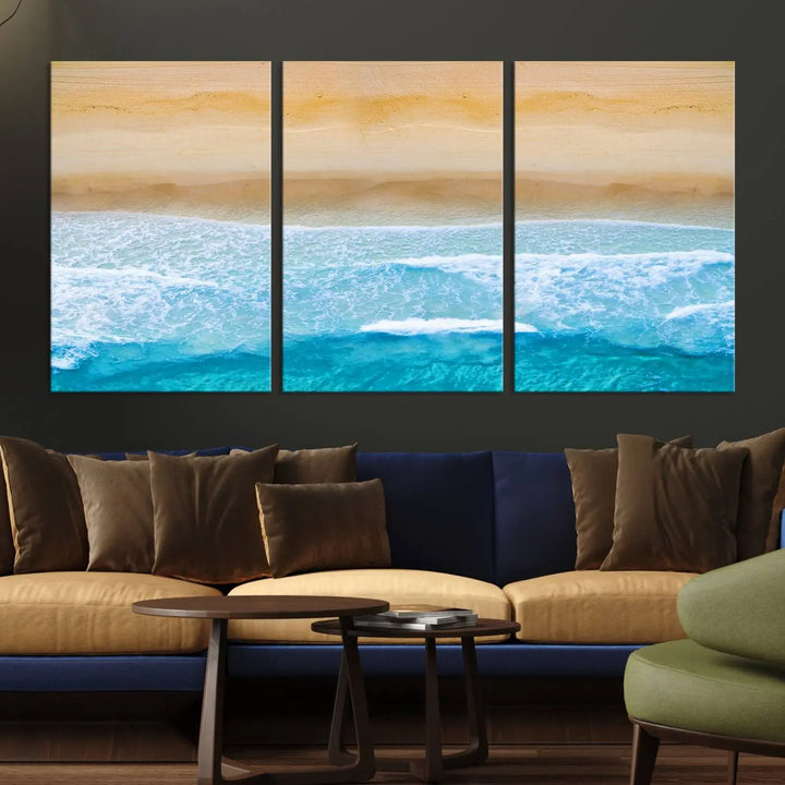 The Stunning Aerial Beach Canvas Print Wall Art, depicting turquoise waves and golden sand, is printed on museum-quality canvas.