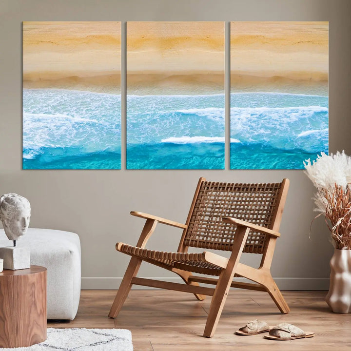 The Stunning Aerial Beach Canvas Print Wall Art, depicting turquoise waves and golden sand, is printed on museum-quality canvas.