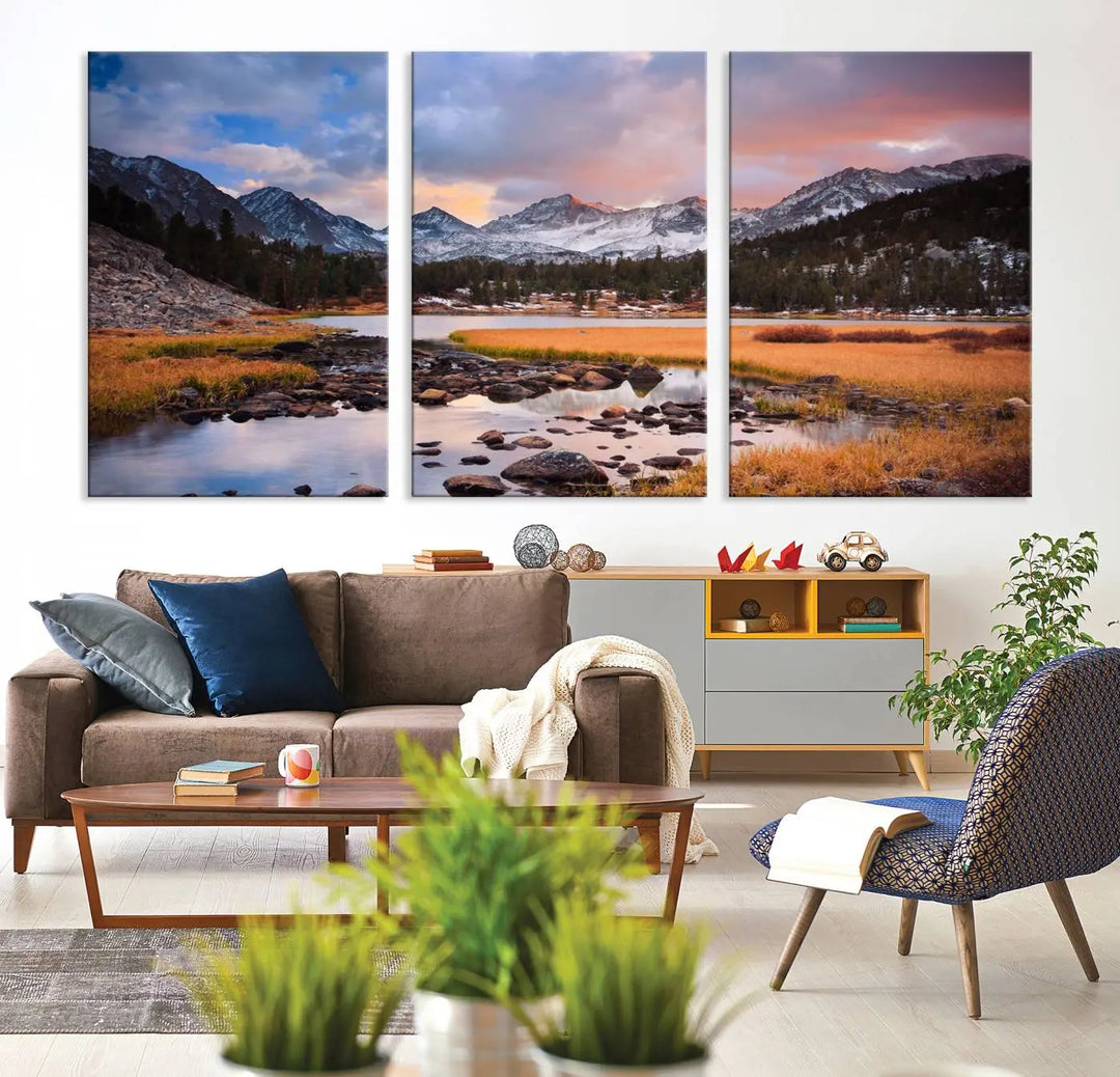 The living room features the Stunning Mountain Landscape Canvas Wall Art Print, a museum-quality triptych painting on UV-protective canvas that depicts majestic mountains and a serene river.