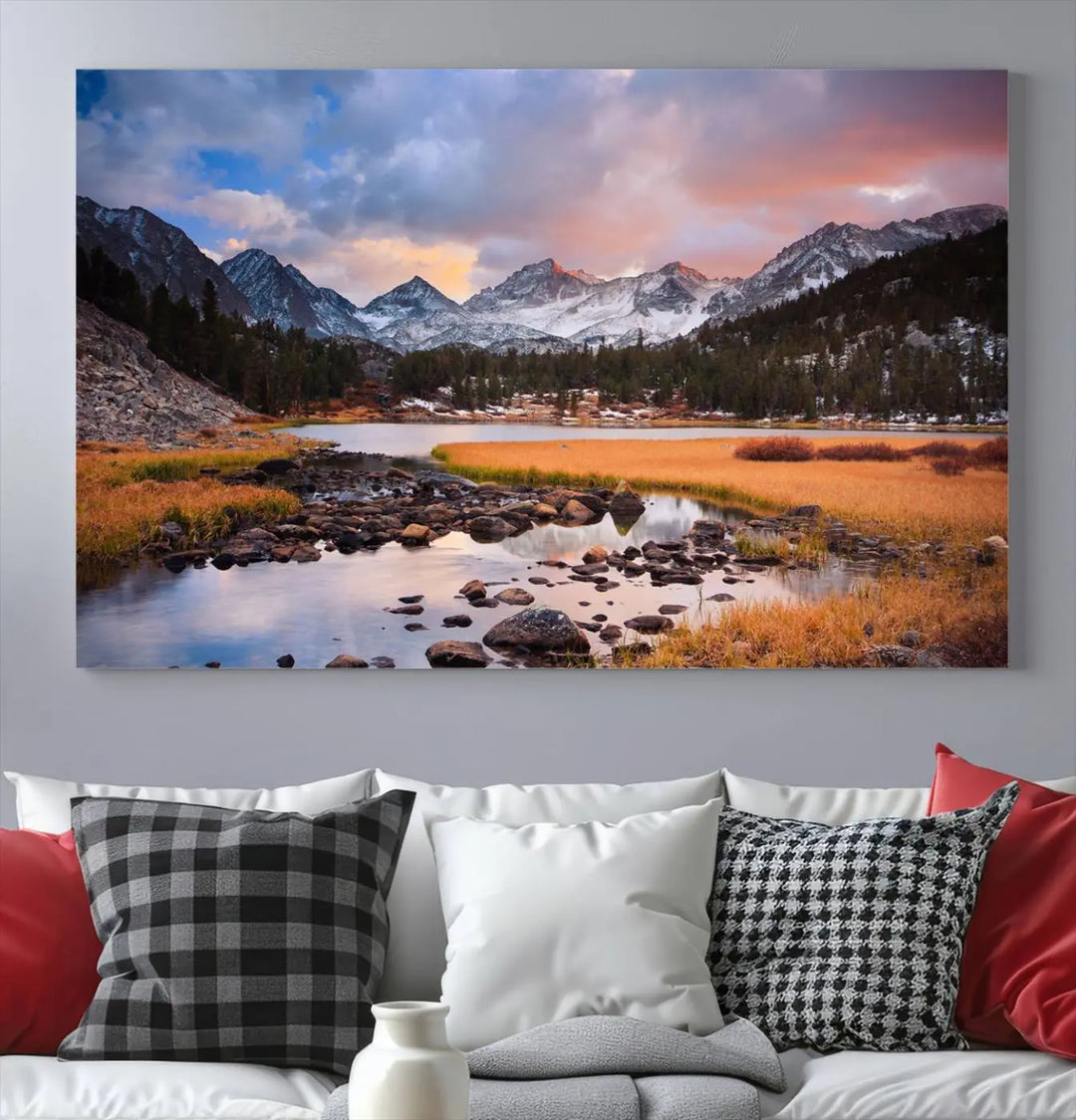 The living room features the Stunning Mountain Landscape Canvas Wall Art Print, a museum-quality triptych painting on UV-protective canvas that depicts majestic mountains and a serene river.