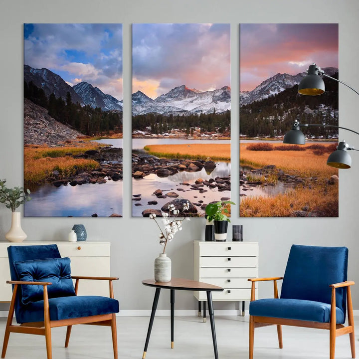 The living room features the Stunning Mountain Landscape Canvas Wall Art Print, a museum-quality triptych painting on UV-protective canvas that depicts majestic mountains and a serene river.