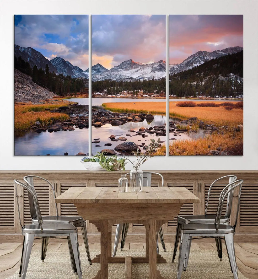 The living room features the Stunning Mountain Landscape Canvas Wall Art Print, a museum-quality triptych painting on UV-protective canvas that depicts majestic mountains and a serene river.