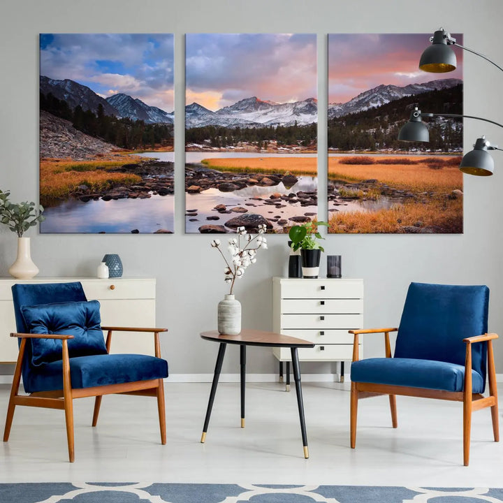 The living room features the Stunning Mountain Landscape Canvas Wall Art Print, a museum-quality triptych painting on UV-protective canvas that depicts majestic mountains and a serene river.