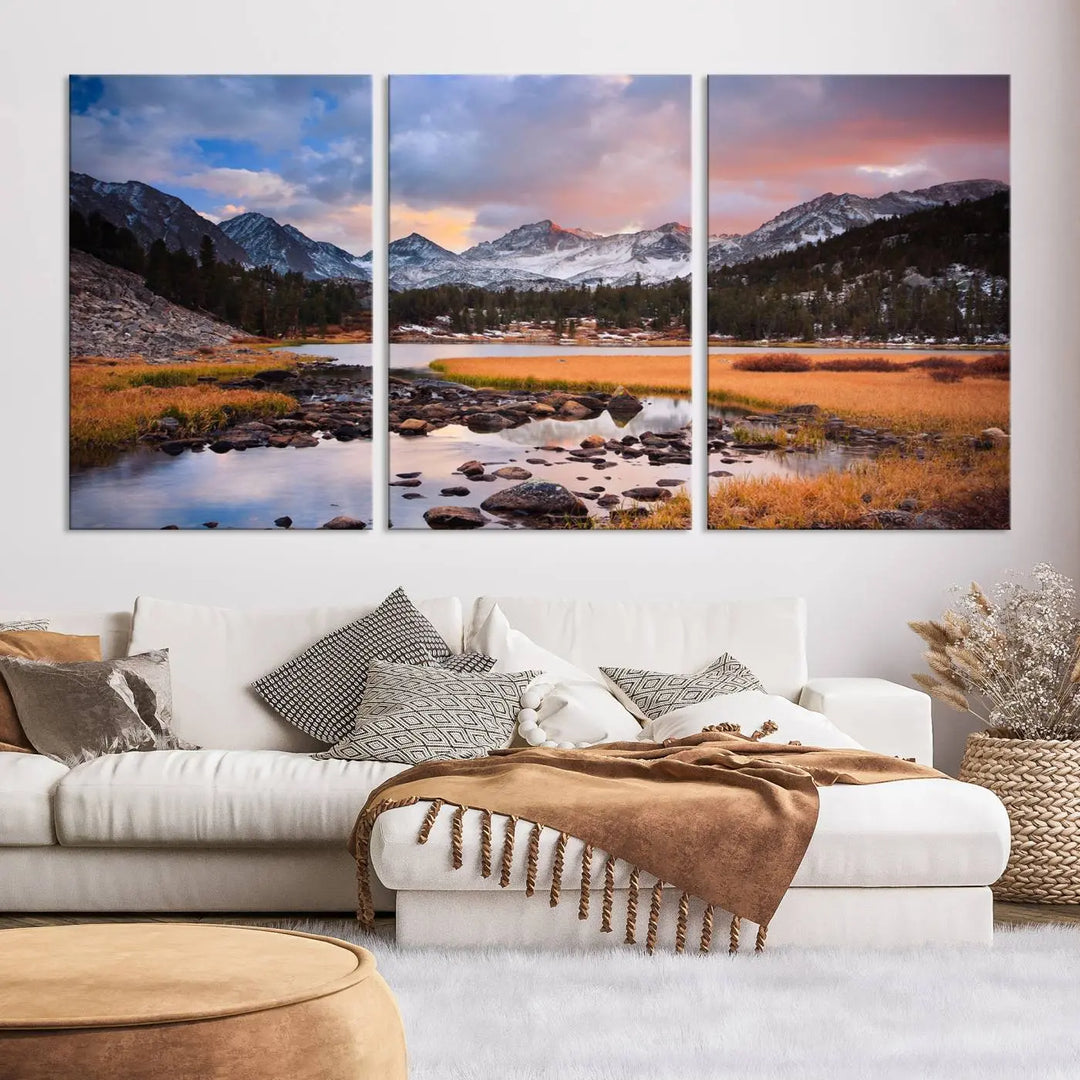 The living room features the Stunning Mountain Landscape Canvas Wall Art Print, a museum-quality triptych painting on UV-protective canvas that depicts majestic mountains and a serene river.