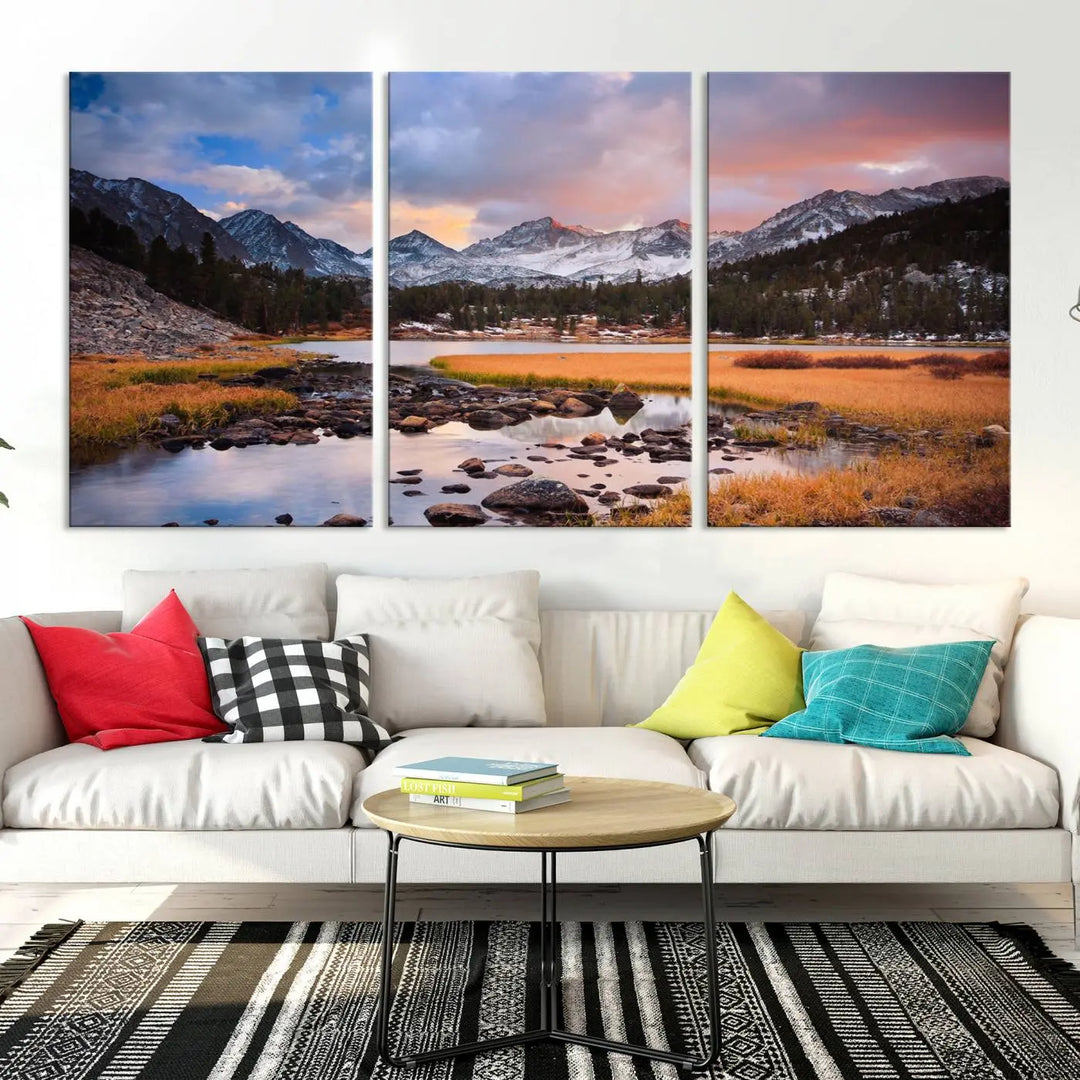 The living room features the Stunning Mountain Landscape Canvas Wall Art Print, a museum-quality triptych painting on UV-protective canvas that depicts majestic mountains and a serene river.