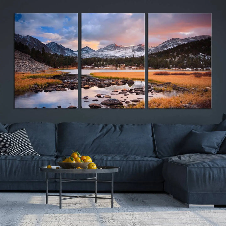 The living room features the Stunning Mountain Landscape Canvas Wall Art Print, a museum-quality triptych painting on UV-protective canvas that depicts majestic mountains and a serene river.