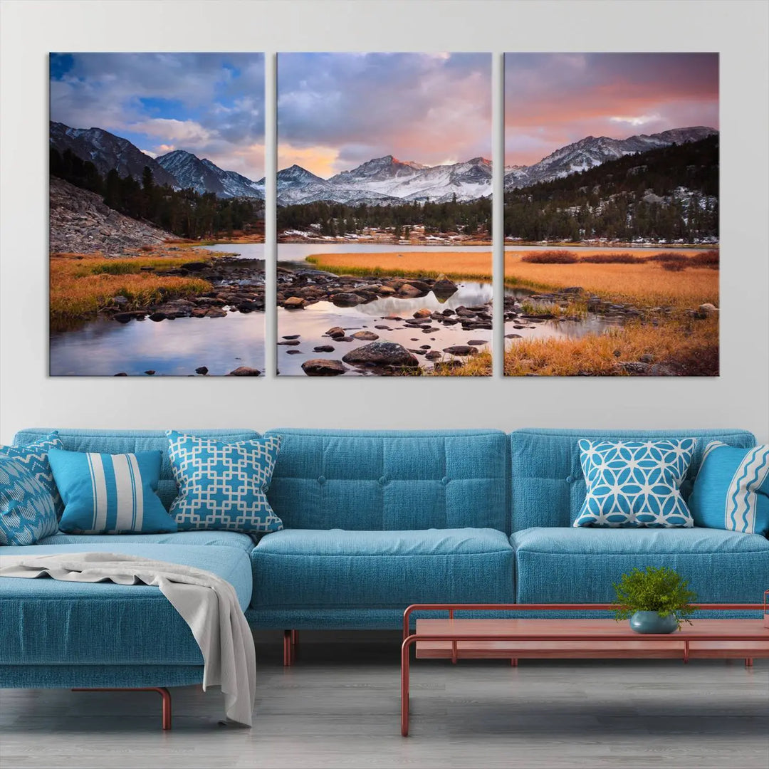 The living room features the Stunning Mountain Landscape Canvas Wall Art Print, a museum-quality triptych painting on UV-protective canvas that depicts majestic mountains and a serene river.