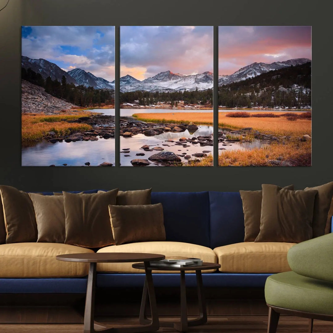 The living room features the Stunning Mountain Landscape Canvas Wall Art Print, a museum-quality triptych painting on UV-protective canvas that depicts majestic mountains and a serene river.