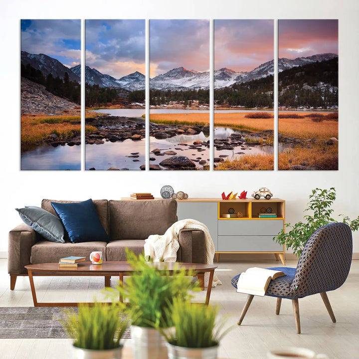 The living room features the Stunning Mountain Landscape Canvas Wall Art Print, a museum-quality triptych painting on UV-protective canvas that depicts majestic mountains and a serene river.