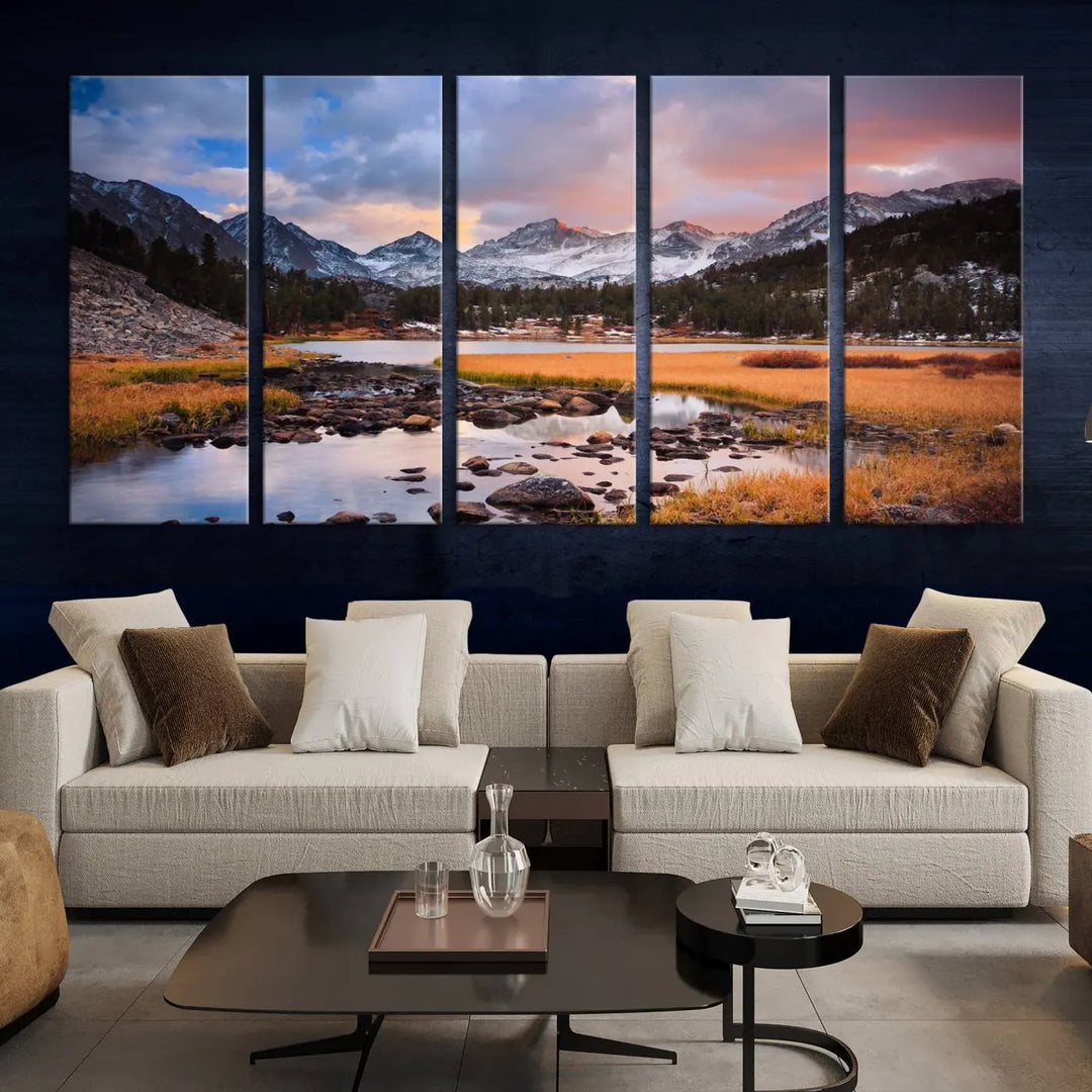 The living room features the Stunning Mountain Landscape Canvas Wall Art Print, a museum-quality triptych painting on UV-protective canvas that depicts majestic mountains and a serene river.