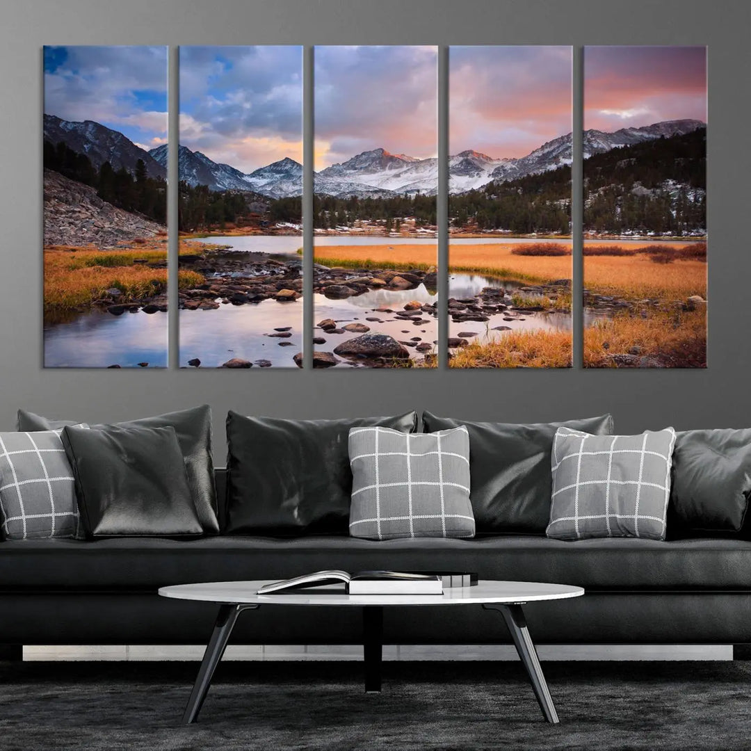 The living room features the Stunning Mountain Landscape Canvas Wall Art Print, a museum-quality triptych painting on UV-protective canvas that depicts majestic mountains and a serene river.