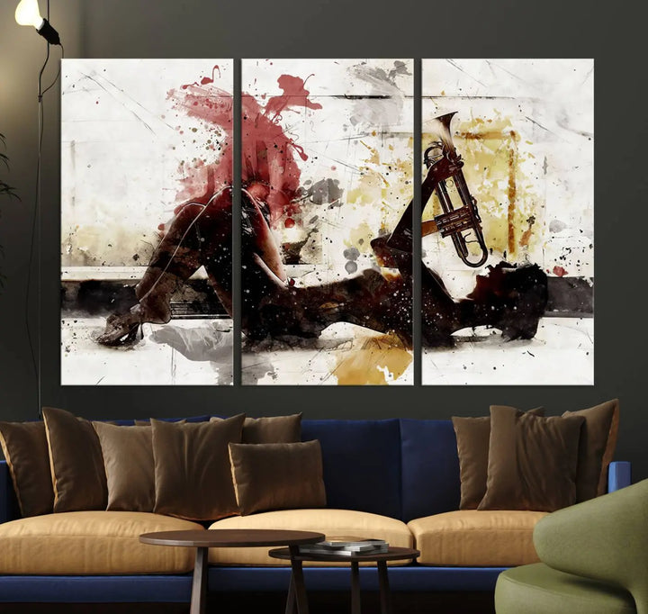 Introducing the Stylish Jazz Woman with Trumpet Triptych Canvas Art: This modern abstract wall décor features a captivating painting of a person lying with a trumpet, set against an abstract background with dynamic red and yellow splashes. This triptych artwork beautifully captures the essence of music and emotion in vibrant colors.