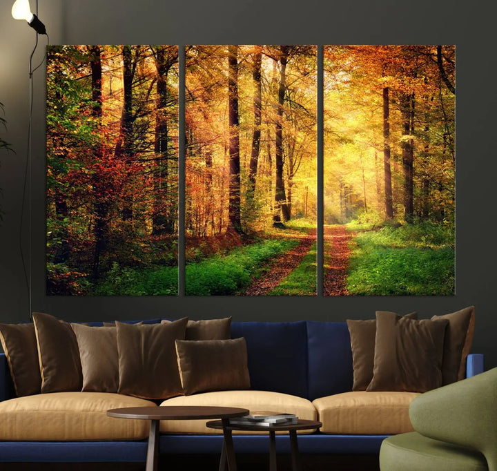 The Sunlight Through Trees Wall Art Canvas Print showcases a sunlit forest path in autumn on gallery-wrapped, museum-quality canvas with UV-protective coating.