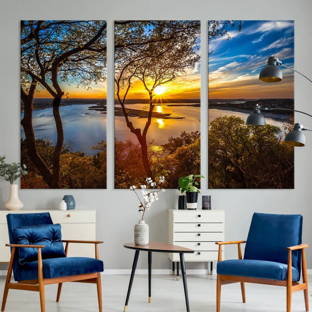 The quad panel nature print titled "Sunrise Over the River Canvas Wall Art" showcases a picturesque sunrise over a river, framed by trees.