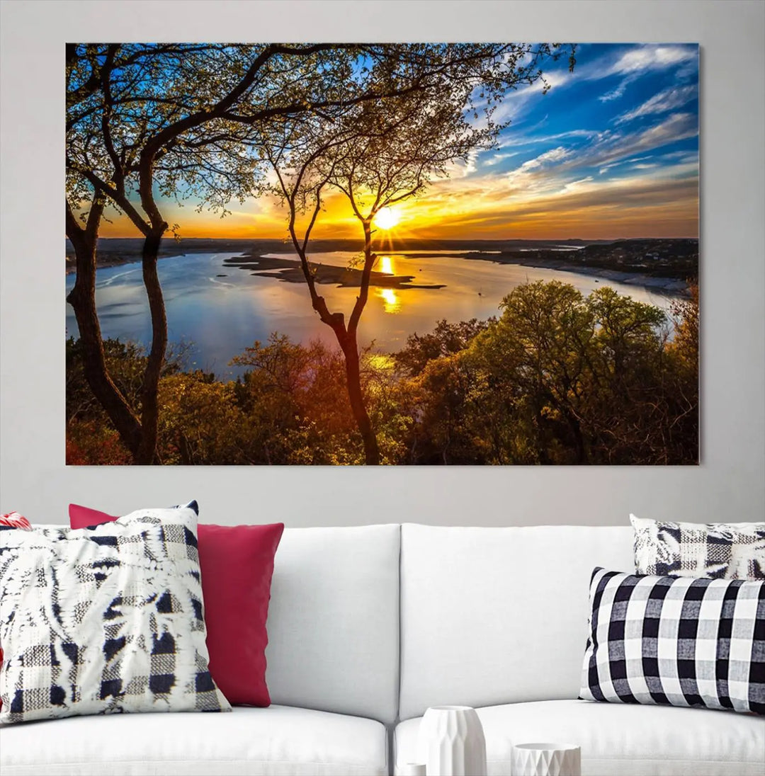 The quad panel nature print titled "Sunrise Over the River Canvas Wall Art" showcases a picturesque sunrise over a river, framed by trees.