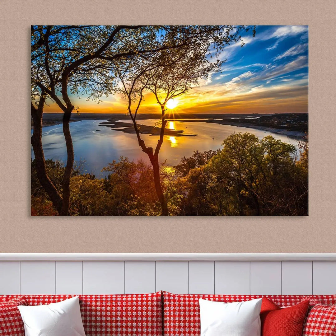 The quad panel nature print titled "Sunrise Over the River Canvas Wall Art" showcases a picturesque sunrise over a river, framed by trees.