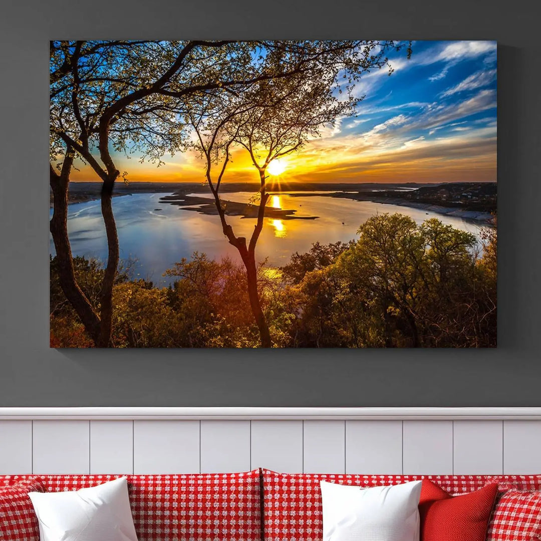 The quad panel nature print titled "Sunrise Over the River Canvas Wall Art" showcases a picturesque sunrise over a river, framed by trees.