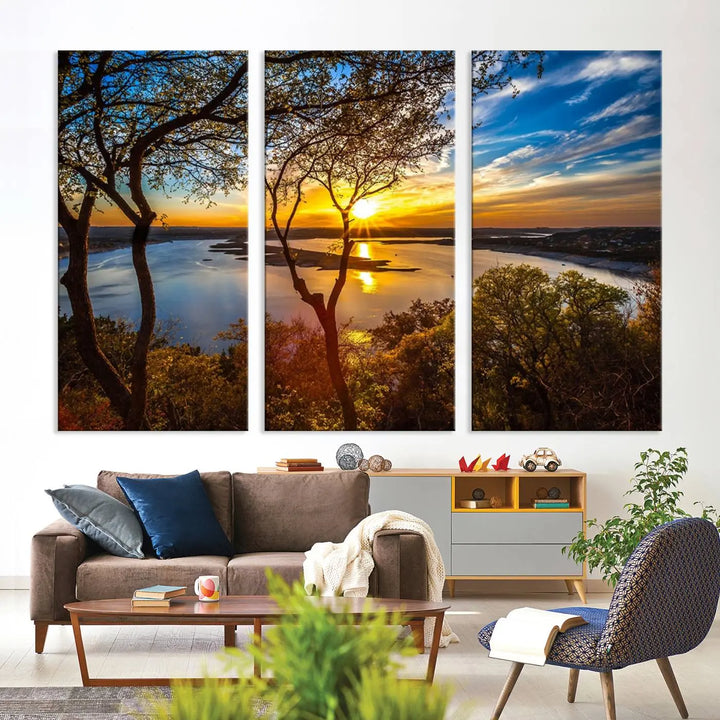 The quad panel nature print titled "Sunrise Over the River Canvas Wall Art" showcases a picturesque sunrise over a river, framed by trees.