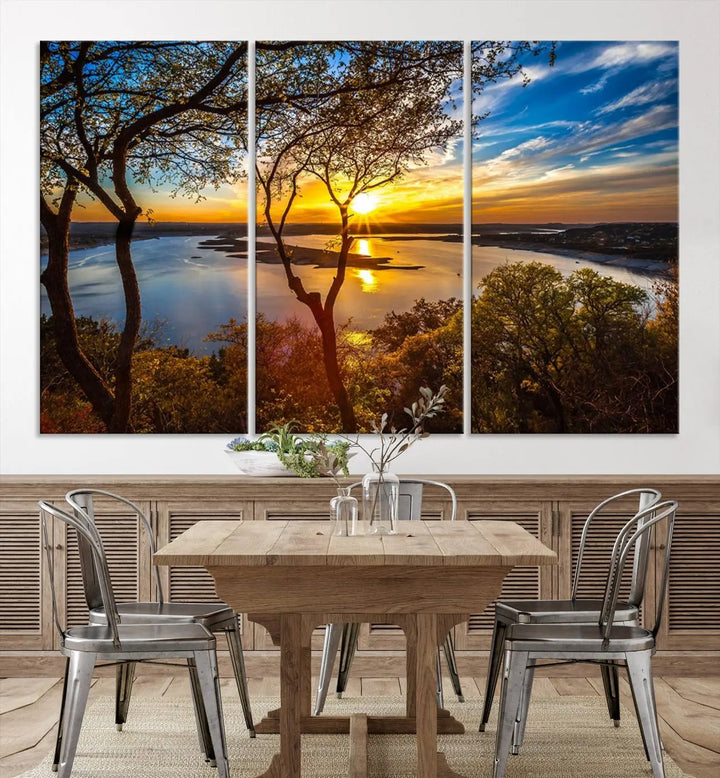 The quad panel nature print titled "Sunrise Over the River Canvas Wall Art" showcases a picturesque sunrise over a river, framed by trees.