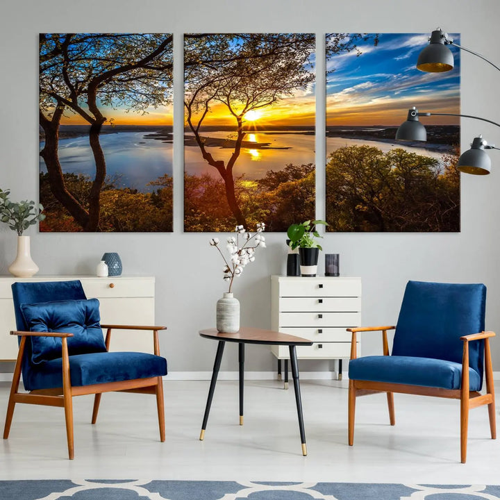 The quad panel nature print titled "Sunrise Over the River Canvas Wall Art" showcases a picturesque sunrise over a river, framed by trees.