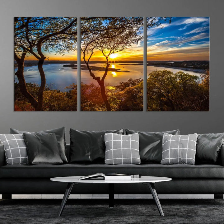 The quad panel nature print titled "Sunrise Over the River Canvas Wall Art" showcases a picturesque sunrise over a river, framed by trees.